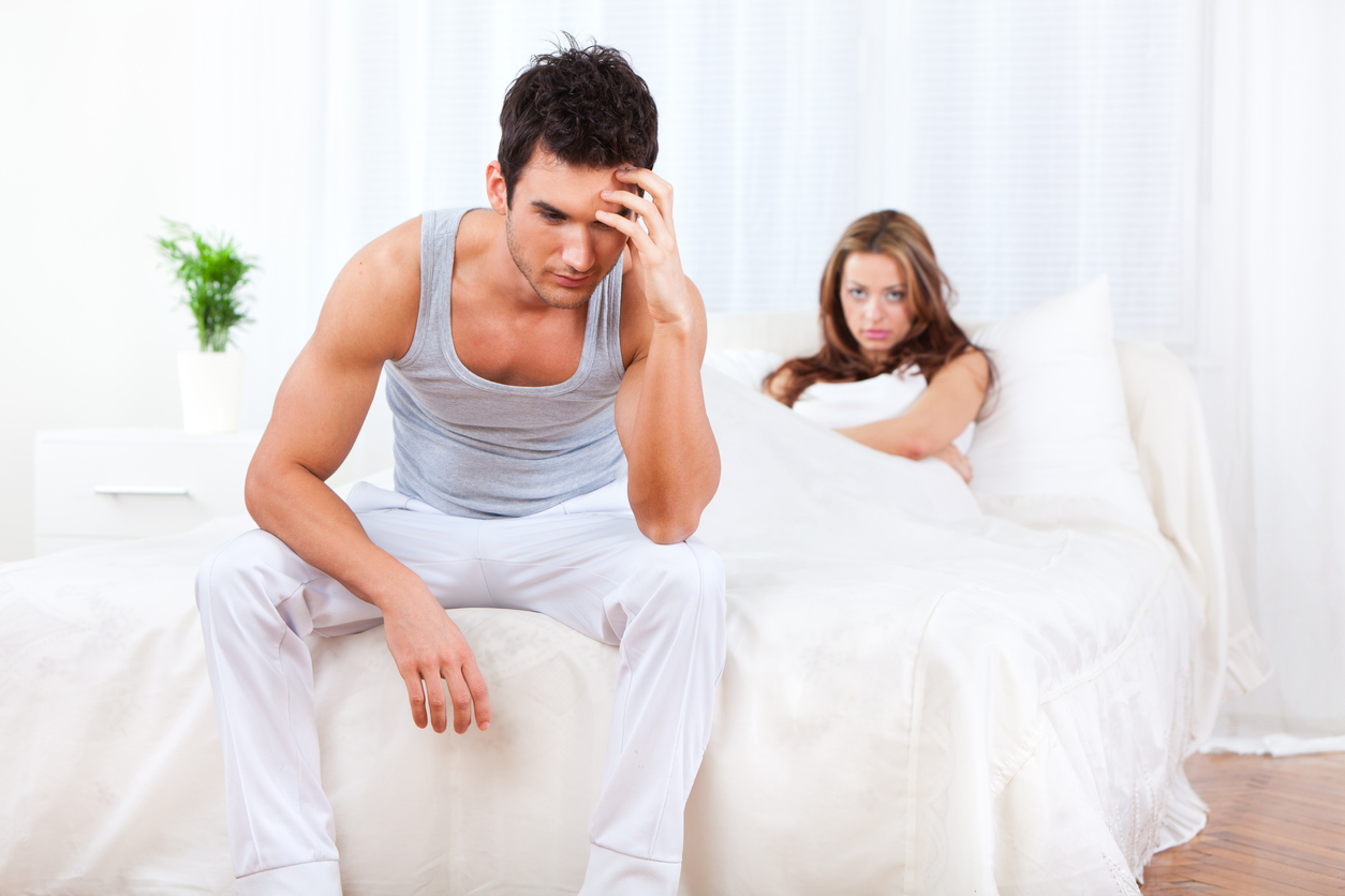 young couple having relationship difficulties in the bedroom