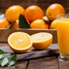 glass,of,fresh,orange,juice,with,fresh,fruits,on,wooden