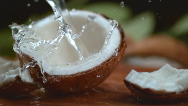 coconut water splashing in super slow motion, shot with phantom flex 4k